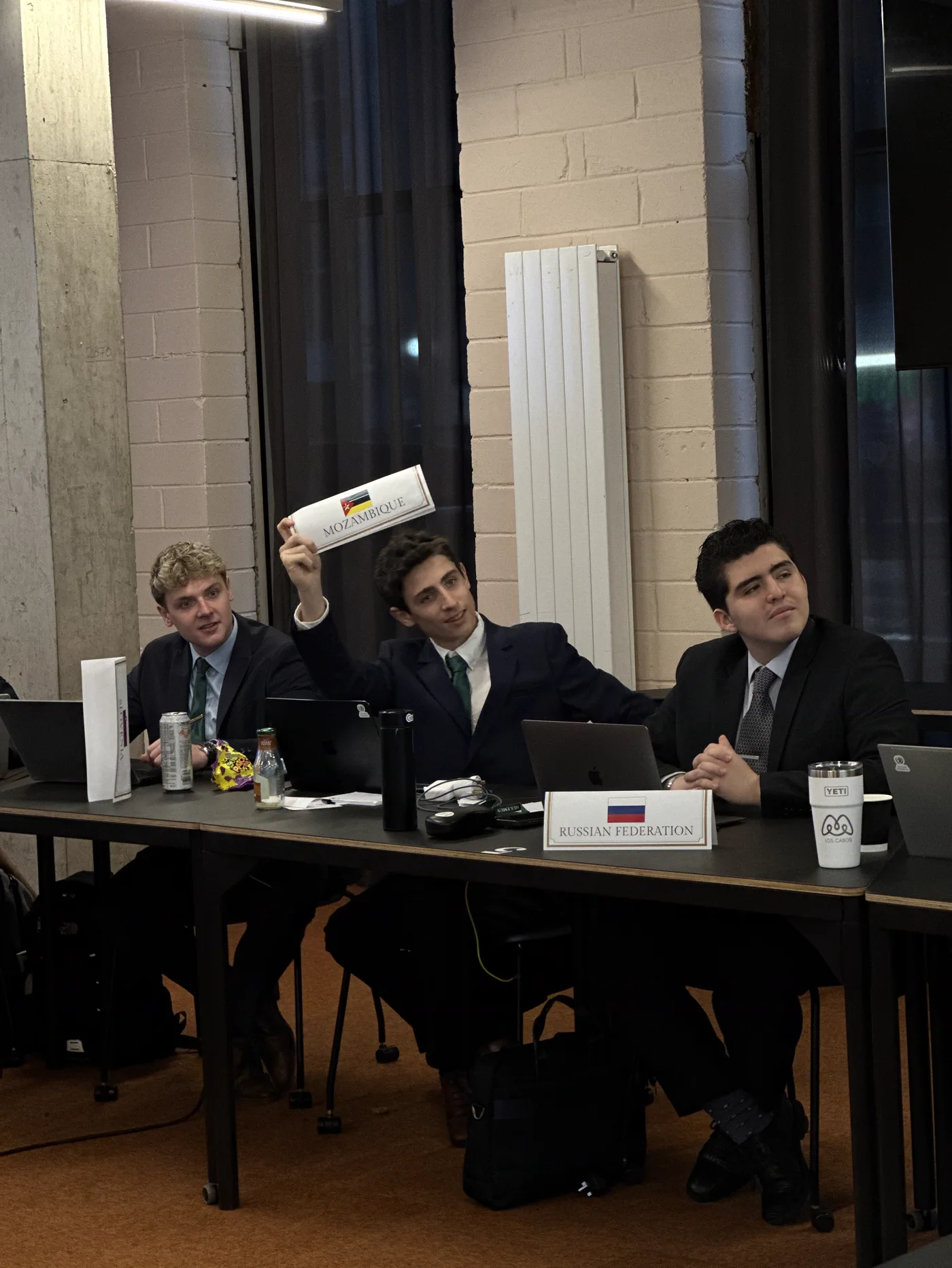 Delegates seated around a committee table at HultMUN 2024